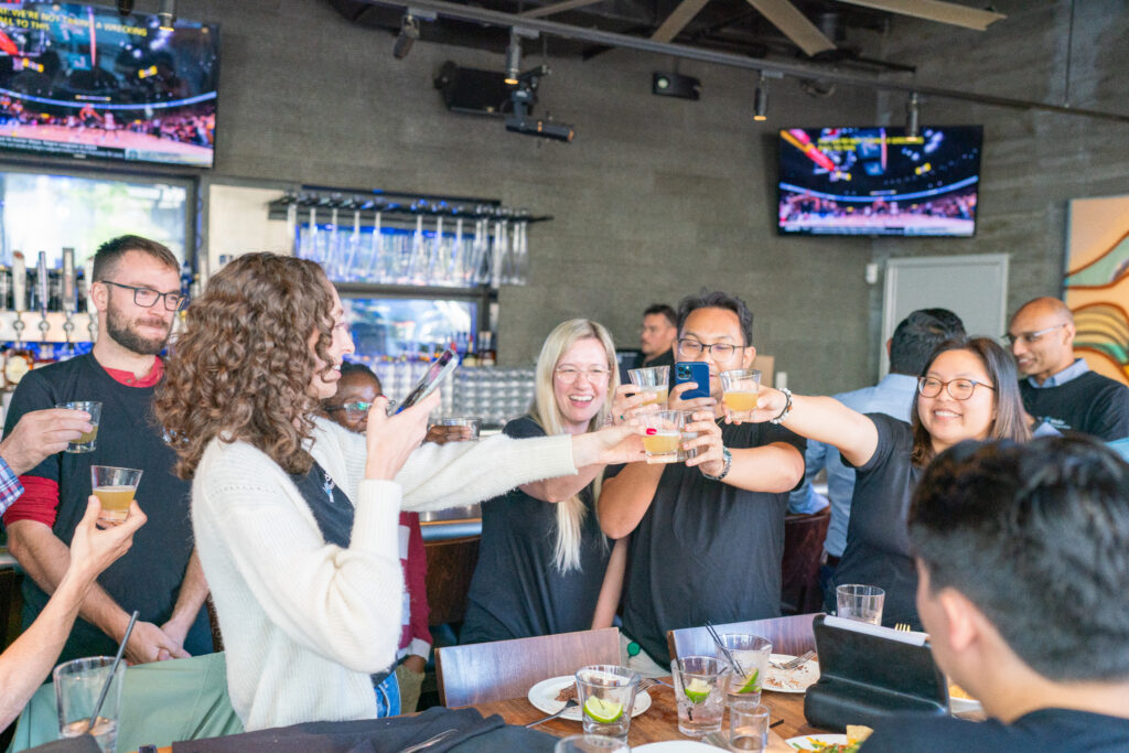 Mediar team members toasting